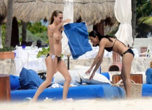 cara-delevingne-topless-on-beach