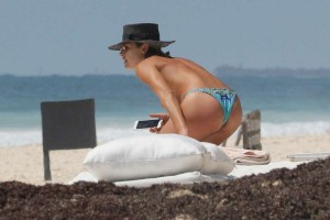 *EXCLUSIVE* Australian beauty Ashley Hart tans topless in Tulum