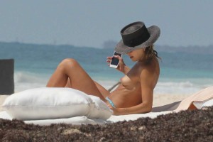 *EXCLUSIVE* Australian beauty Ashley Hart tans topless in Tulum